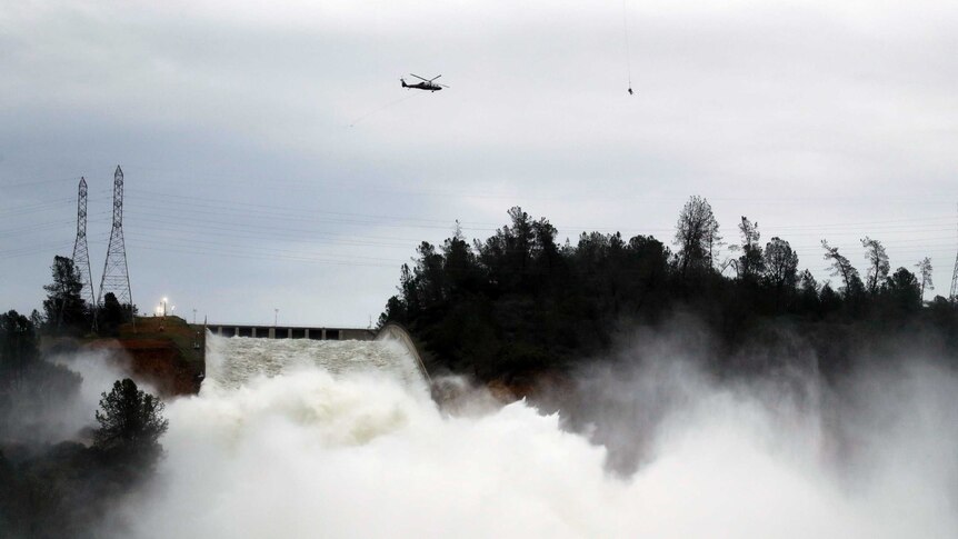 Water gushes down the Oroville Dam's main spillway.