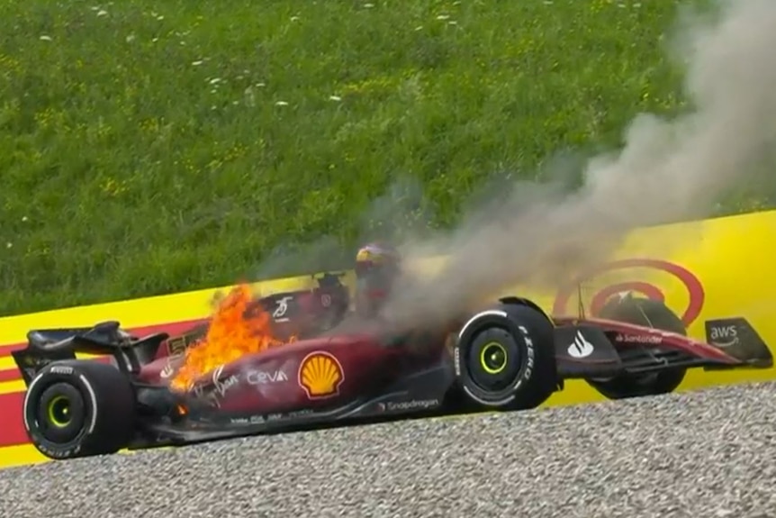 Fire coming from a Ferrari F1 car.