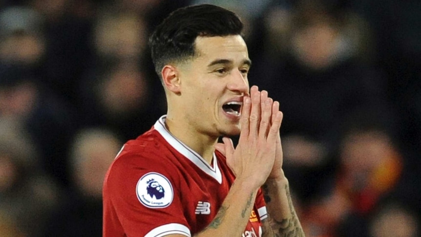 Liverpool's Philippe Coutinho holds his hands to his mouth.