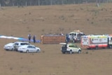 Emergency vehicles at scene of hot air balloon crash.