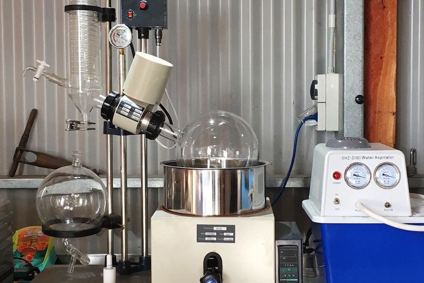 Beakers and scientific machines set up on a table.