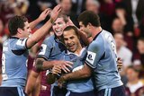 Hazem El Masri celebrates his try with Blues team-mates