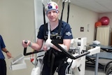 Anthony Fox uses physiotherapy equipment to learn to walk again, after suffering a stroke and then contracting an MRSA.