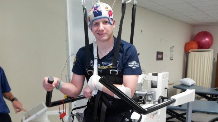 Anthony Fox uses physiotherapy equipment to learn to walk again, after suffering a stroke and then contracting an MRSA.