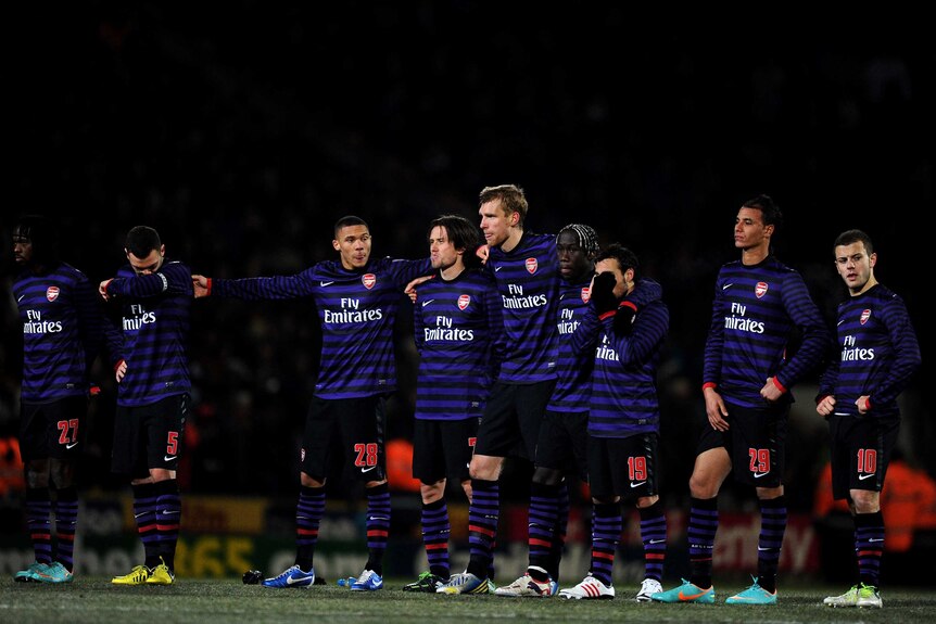 Dejection ... Arsenal players look on as they exit the League Cup.