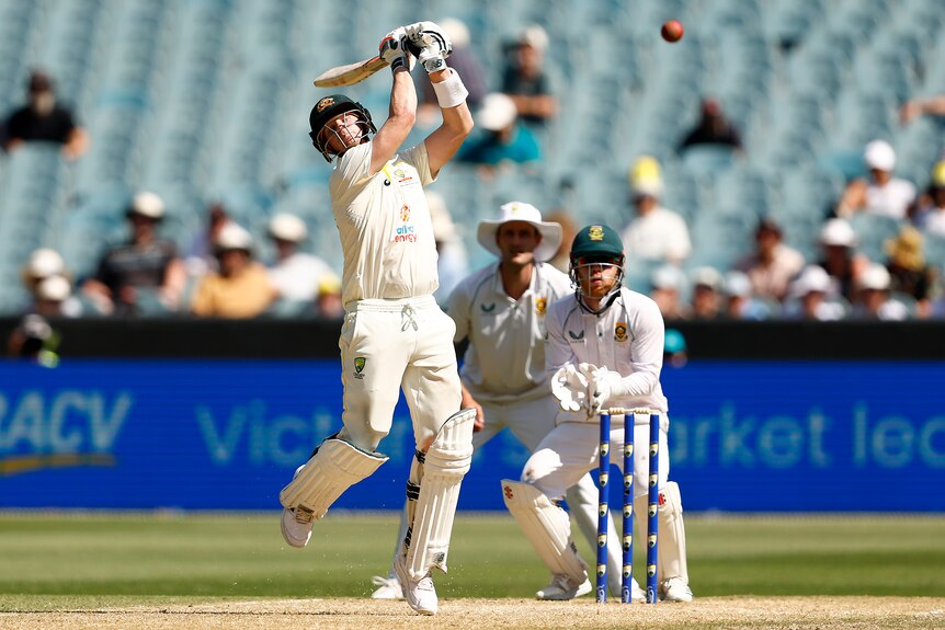 Australia batter Steve Smith flails wildly during a shot in a Test against South Africa.