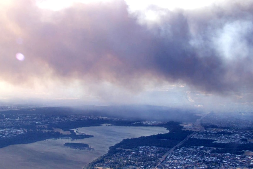 Smoke blankets the sky