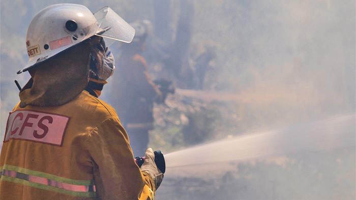 CFS firefighter using firehose