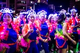 women wearing love hearts on their heads at the mardi gras parade