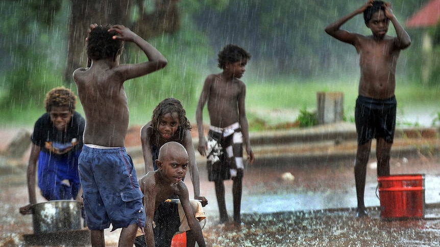Aurukun kids play in the rain