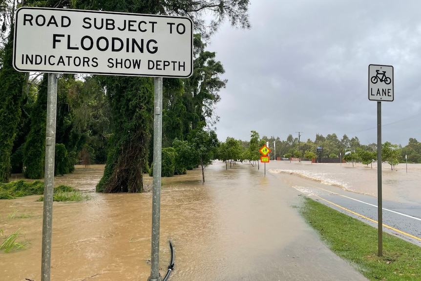 Floodwaters over the road in south-east Queensland.