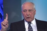 Paul Keating holds one finger up while speaking at the national press club