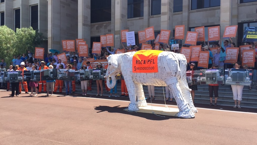 Anti-Roe 8 protestors with their man-made white elephant at Parliament House.