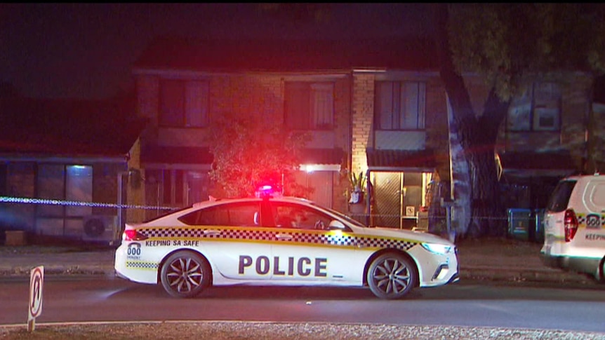 A police car outside a block of units