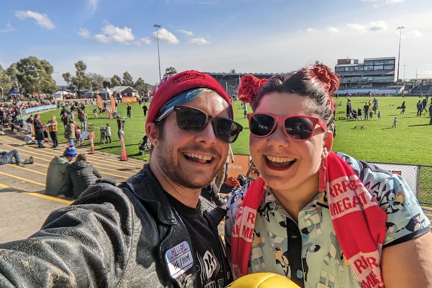 Connor Borchard-Burns and Andy Pullar take a selfie at a football game.