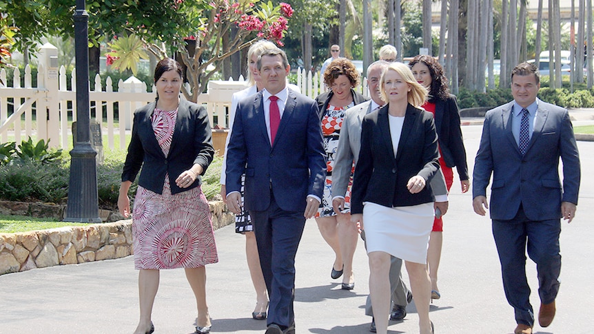 NT Chief Minister Michael Gunner (front in red tie) walks to Government House with his cabinet