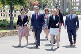 NT Chief Minister Michael Gunner (front in red tie) walks to Government House with his cabinet