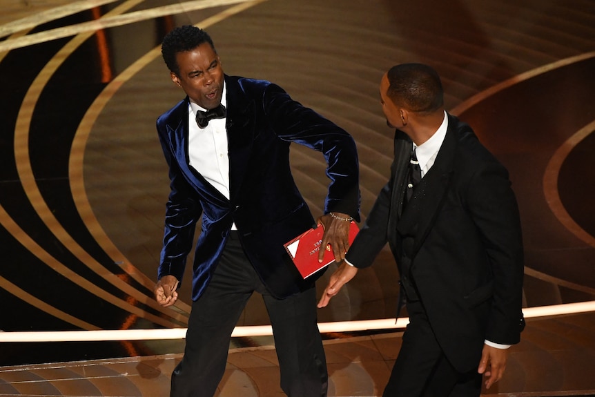 Will Smith appears to hit Chris Rock onstage during the Oscars.