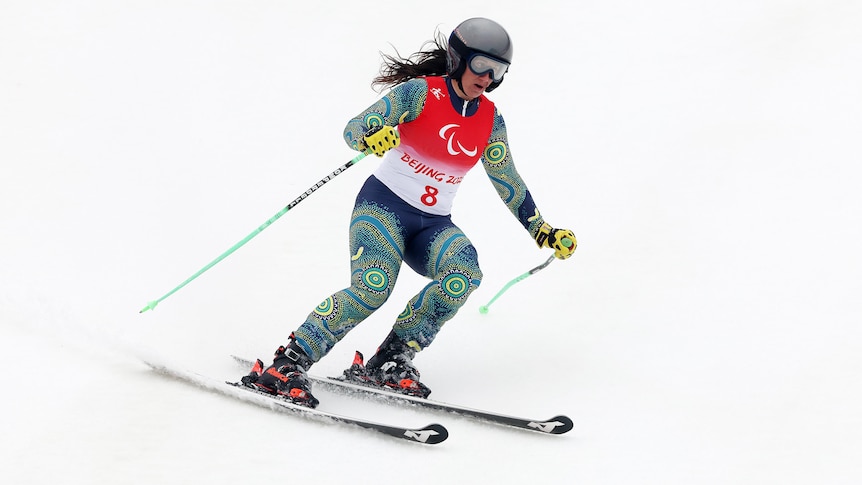 An Australian female skier competes in the vision-impaired giant slalom at the Beijing Winter Paralympics.