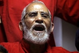 Mohamed Badie shouts in court