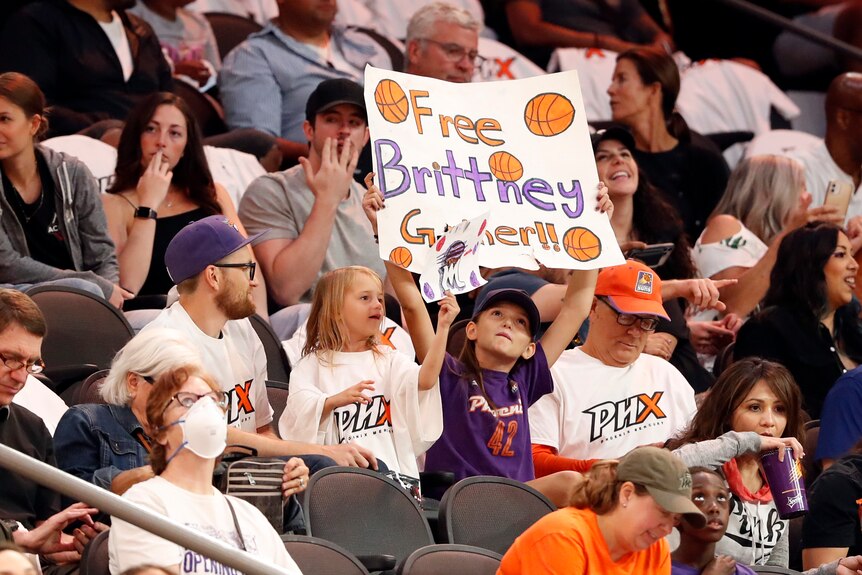A fan holds a sign saying free brittney griner