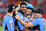Ish Sodhi (centre) of the Strikers is congratulated by 5 of his teammates