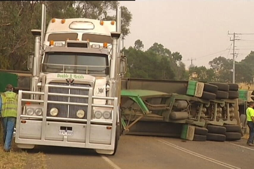 Truck loses its load when taking an alternate route due to road closures caused by fires