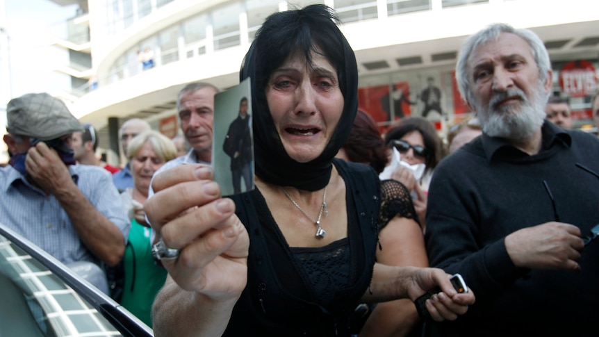 Woman attends protest in Tbilisi