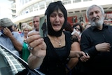 Woman attends protest in Tbilisi