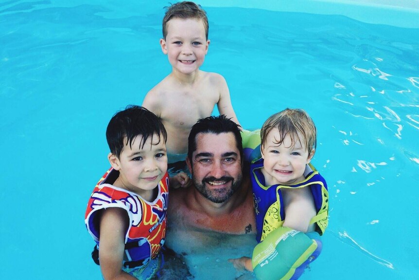 Glenn Hunter swims with and his three sons Rhys, Angus and Isaac showing that boys also need support in being body positive.