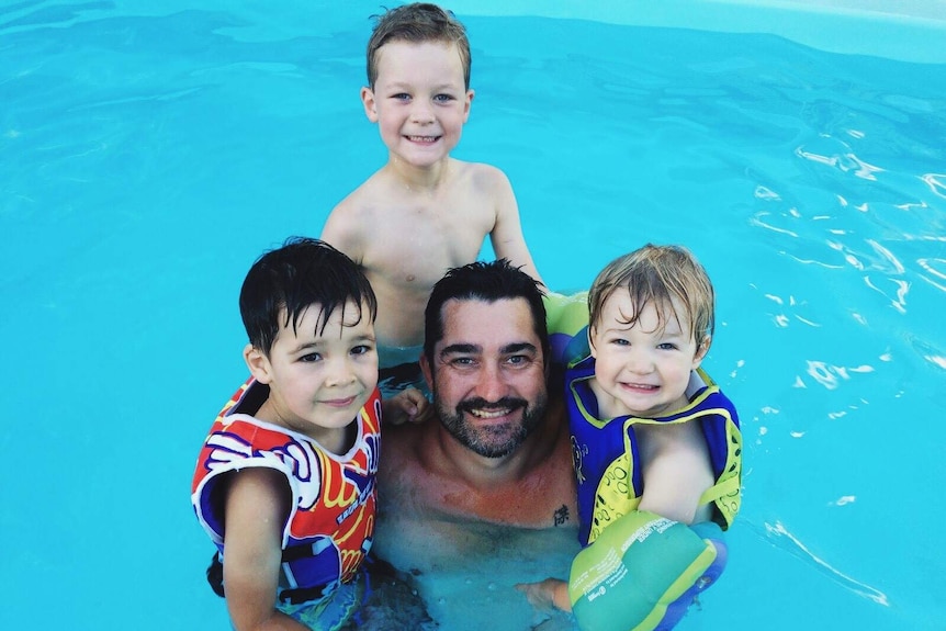 Glenn Hunter swims with and his three sons Rhys, Angus and Isaac showing that boys also need support in being body positive.