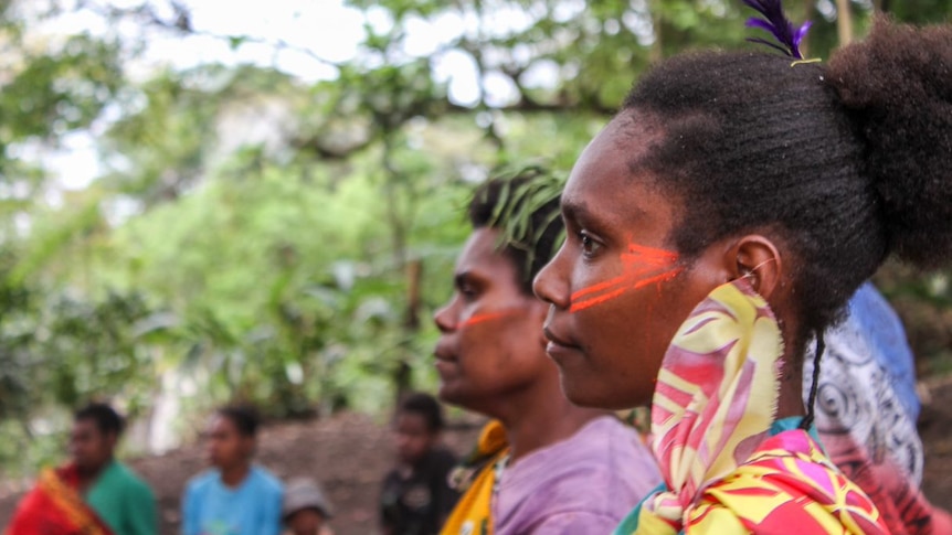 People in traditional dress gather in the village of Loutaliko, on Tanna in Vanuatu.