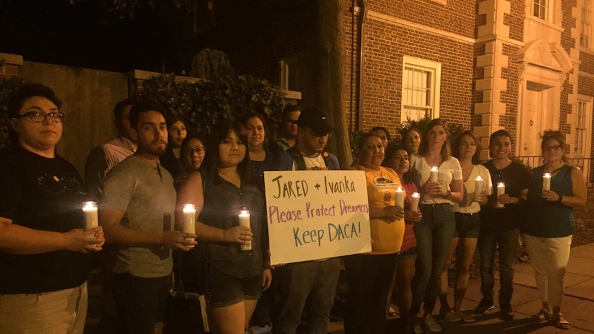 Protesters gather outside Jared Kushner and Ivanka Trump's home in Washington DC for a candlelight vigil.