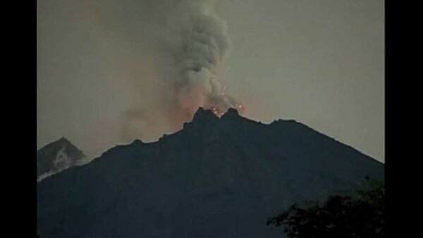 Ecuador's El Reventador volcano spurts lava