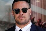 Jarryd Hayne leaving Newcastle local court today with a local police woman
