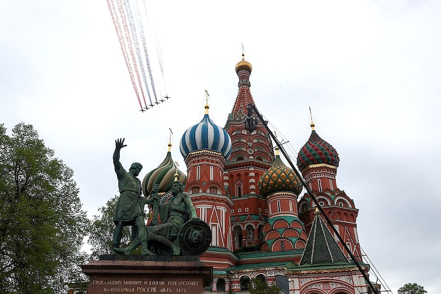 Jets fly over Saint Basil's Cathedral in Red Square, Moscow, Russia.