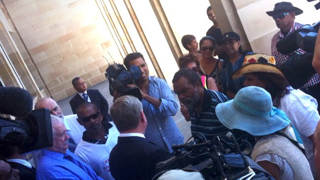 WA Premier Colin Barnett is confronted by a group of Indigenous people
