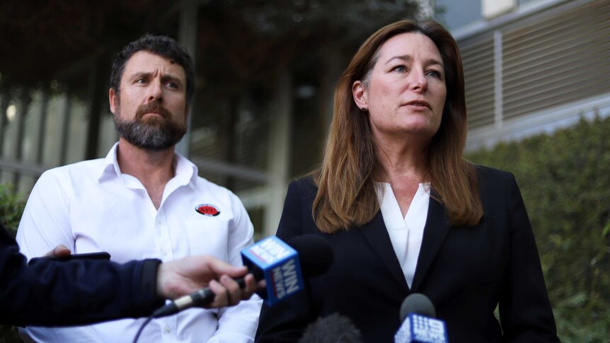 ACT Education Minister Yvette Berry looking serious at a press conference.