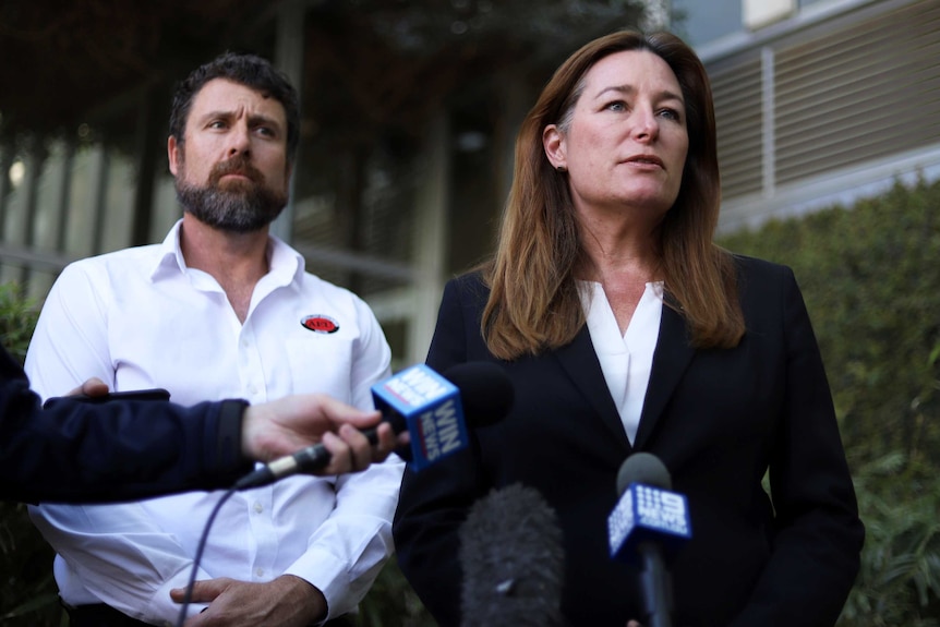 ACT Education Minister Yvette Berry looking serious at a press conference.