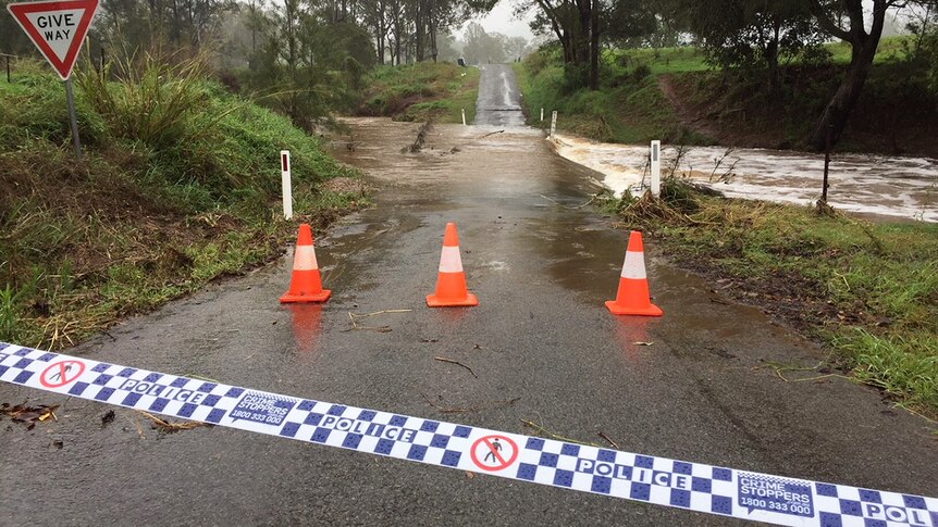 Police tape at flooded causeway where a car was swept away near Gympie on evening of October 16, 2017