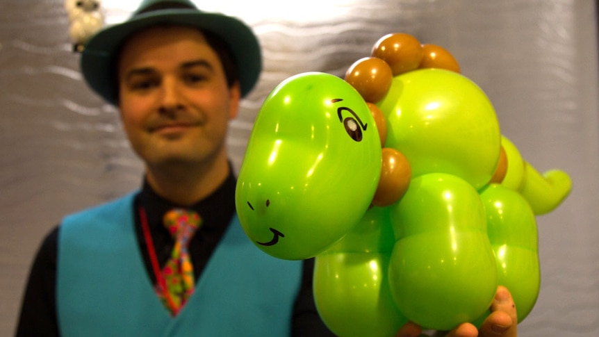 Matt Falloon shows off his balloon art