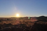Sunset over the red dust of the outback APY Lands
