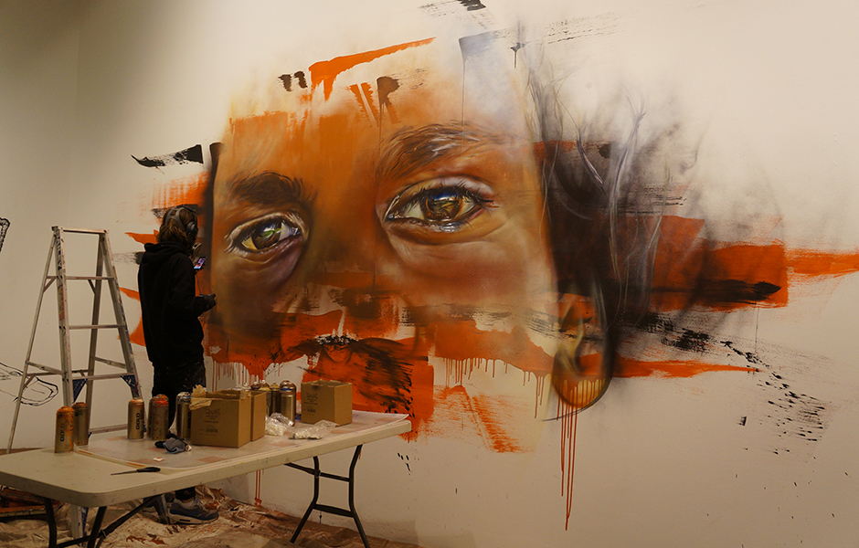 Adnate painting straight onto the Benalla Art Gallery wall.