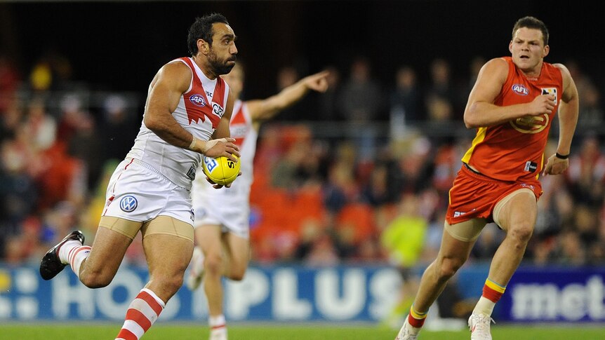 On song ... Adam Goodes moves the Swans forward in attack