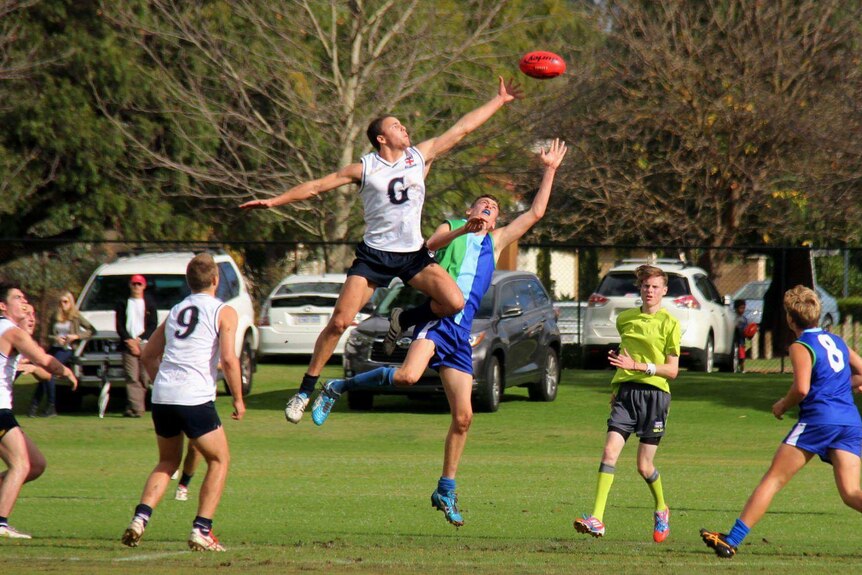 Swan Districts key defender Griffin Logue goes for a high mark.