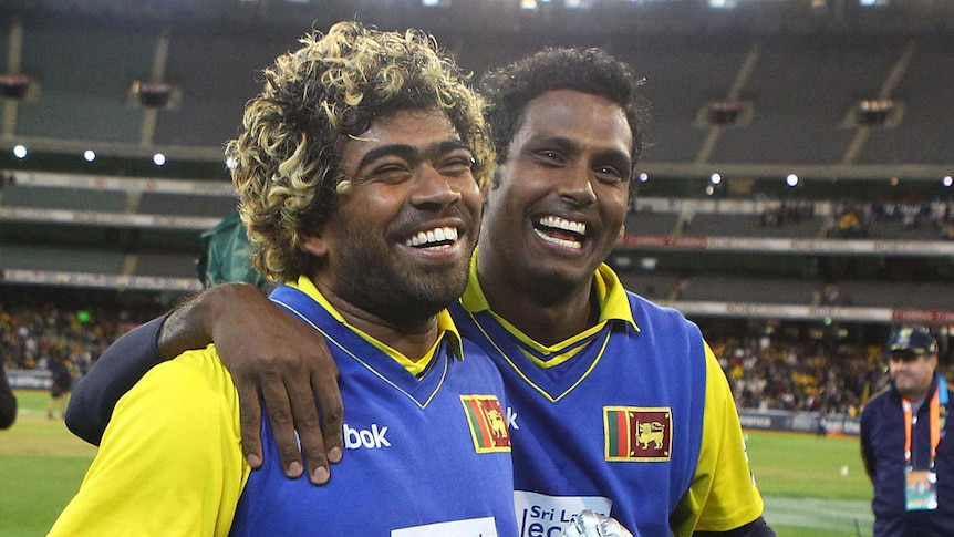 Lasith Malinga and Angelo Mathews celebrate after their record 132-run stand
