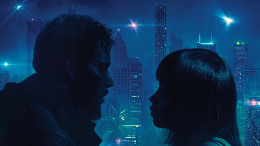 A man and woman - in silhouette - stare into each other's eyes. Behind them is a futuristic city.