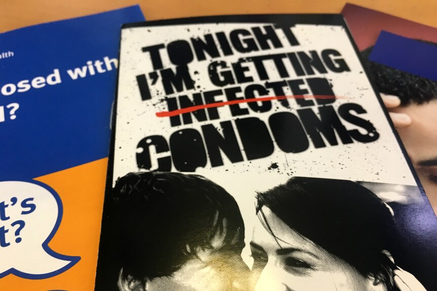 Brochure saying Tonight I'm getting infected, but the word infected is crossed out and replaced with condoms.