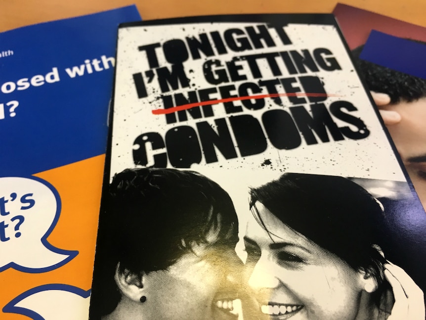 Brochure saying Tonight I'm getting infected, but the word infected is crossed out and replaced with condoms.