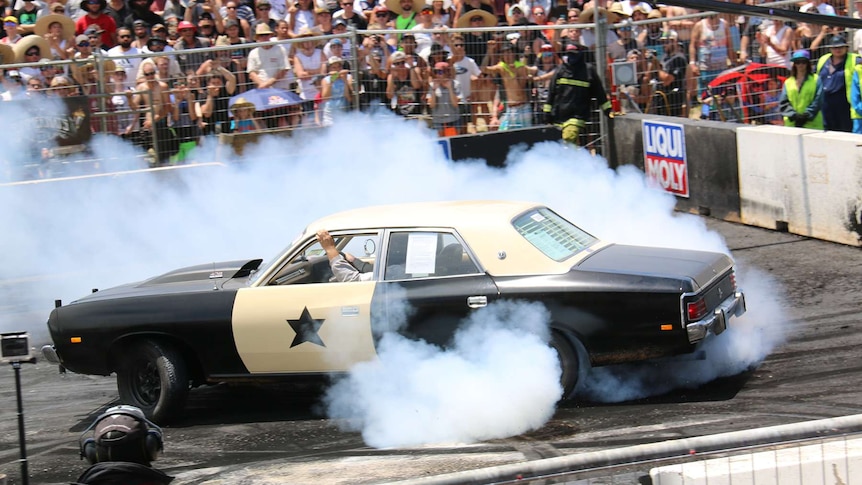 A car does a donut on the burnout pad at Summernats in Canberra.